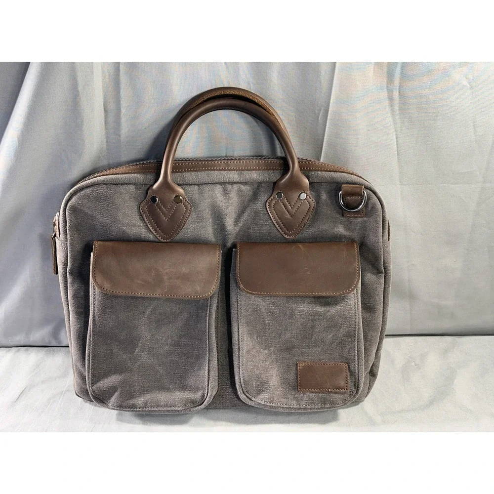 Renwick canvas briefcase featuring genuine leather trim missing shoulder strap